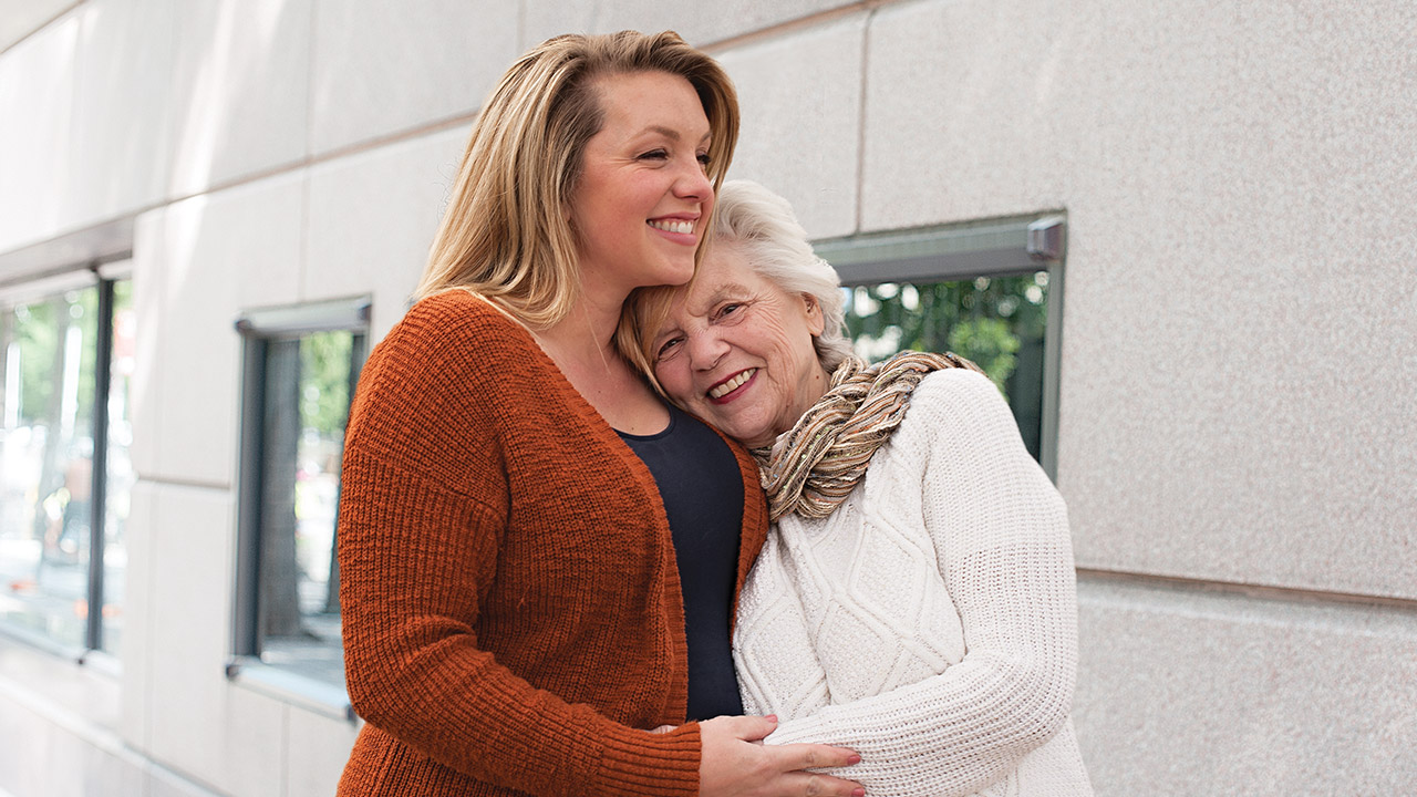 Woman hugging her grandmother